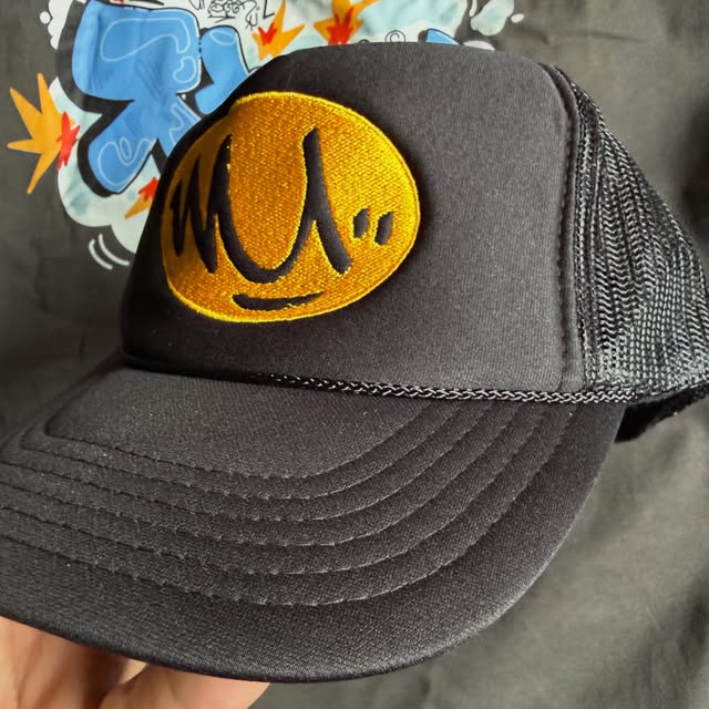 Black Worlds Unseen cap with an embroidered yellow mark