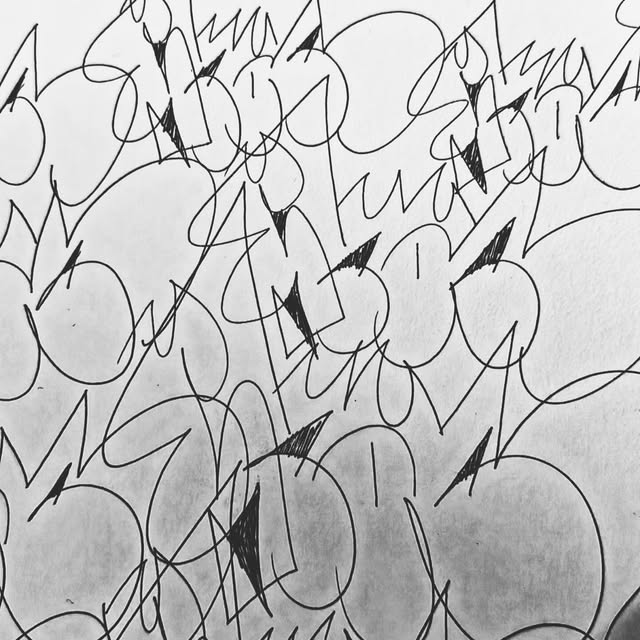 A field of hand-drawn black marks